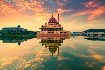 Fototapeta premium Beautiful sunrise over Putrajaya with soft focus reflection due to long exposure technique