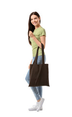Young woman with eco bag on white background