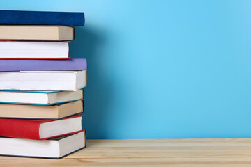 A stack of books on shelf. Background with copy space.