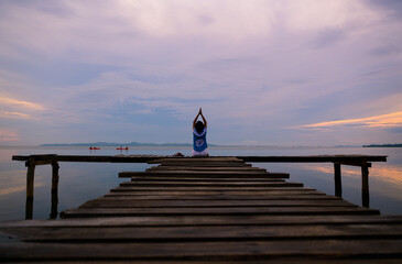 people walk on the bridge over the sea in the morning