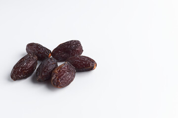 handful of sluggish dates on a white background. dried fruits isolate. copy space for text