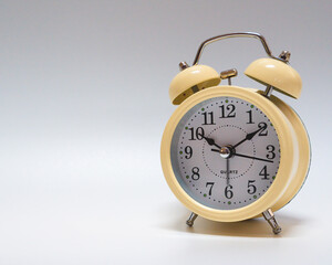 analog alarm clock on white background