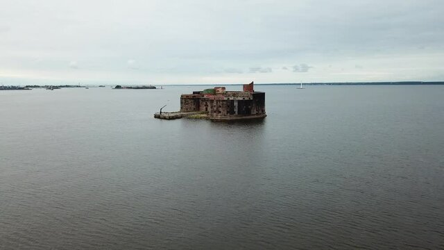 4K aerial cloudy morning video of Fort Alexander 1 bastion, its fortifications, armaments and Baltic Sea Finnish Bay panorama near Kronstadt and Saint Petersburg in northern Russia