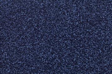 Grainy navy blue background with spotted pattern. Texture backdrop with small crumb pattern for interior design.