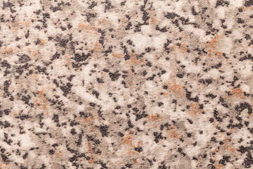 Abstract art background black, brown and gray color. Texture of stone tabletop and coutertop with beige blotches.