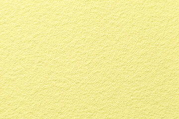 Texture of Light yellow old decorative plaster material with pattern, macro background.
