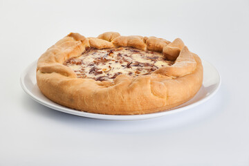 onion pie with greens on a white background