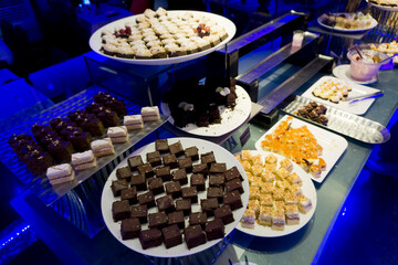 Close up view of assortment of fresh dessert captured from above with bokeh effect
