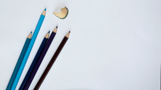 Blue and Purple pencils on white background