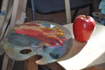 palette with paints and brushes