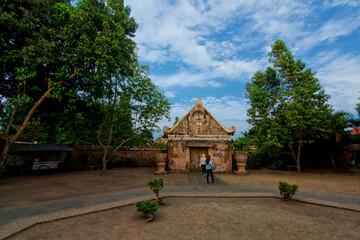 Beautiful achitecture building and two girls in hijab touring around Taman Sari