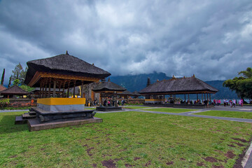 Fototapeta na wymiar Unique architectural design of hutts around Bratan Lake inspired by Balinese Hinduism