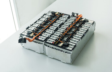 Selective focus of Electric car lithium battery pack and wiring connections internal between cells on background.