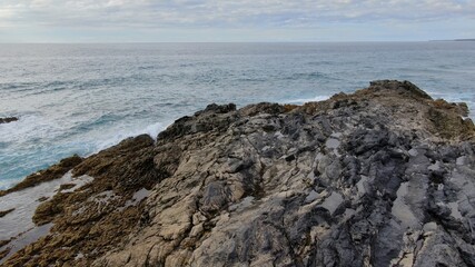Fototapeta na wymiar where volcanic lava meets the sea creating a wonderful place