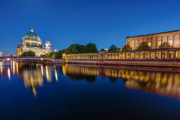 The Berlin Cathedral and the Old National Gallery on the Museum Island in Berlin at night © elxeneize