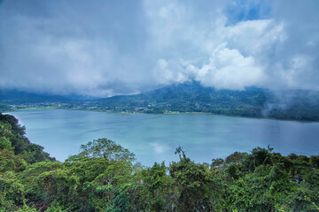 Magnificent view of Buyan Lake in Bali. Soft focus effect due to long exposure technique