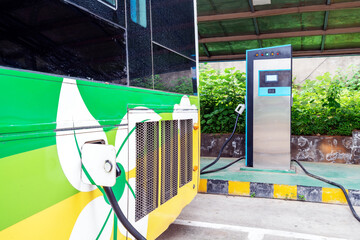 Charging station of an electric car in the background of a bus