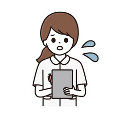 カルテに記入をする看護師