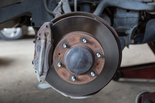 Closeup of car disc brake at car workshop