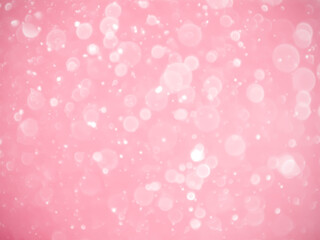 pink background with soft bokeh lights.