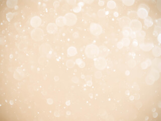 Golden background with soft bokeh lights.