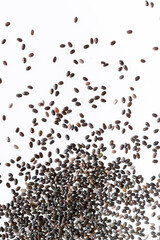 Small group of chia seeds isolated on white background. Closeup. Top view. Chia super food.