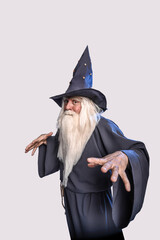 A severe grey-haired bearded sorcerer in a gray cassock and a cap is practicing sorcery and doing...