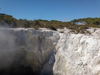 Hot smoke billowing out of a geo thermal valley