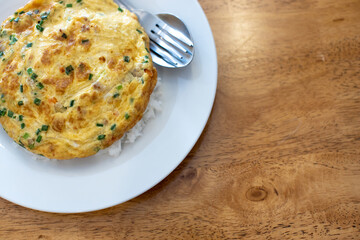 Omelette on top until white, with spoon and fork.