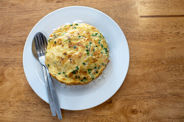 Omelette on top until white, with spoon and fork.