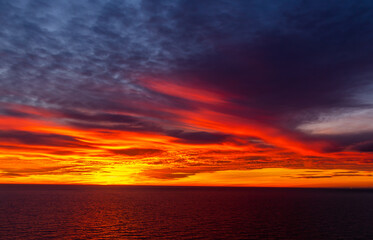 Naklejka na ściany i meble Beautiful dark orange sky evening beauty and Clouds at sunset
