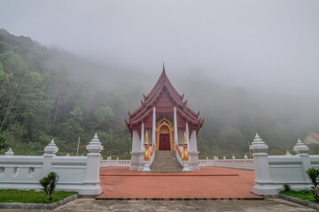 view morning of buddhist temple around with soft fog background, Wat Santi Khiri, Doi Mae Salong...