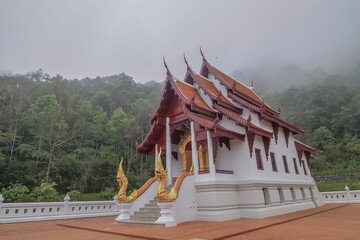 view morning of buddhist temple around with soft fog background, Wat Santi Khiri, Doi Mae Salong...
