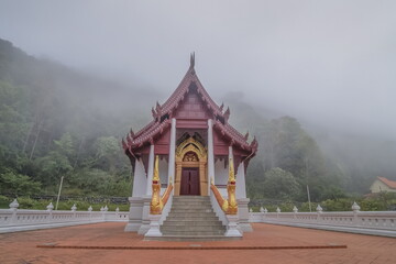 view morning of buddhist temple around with soft fog background, Wat Santi Khiri, Doi Mae Salong Nok, Chiang Rai, northern of Thailand.