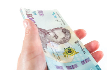 1000 hryvnia on a palm isolated on a white background.