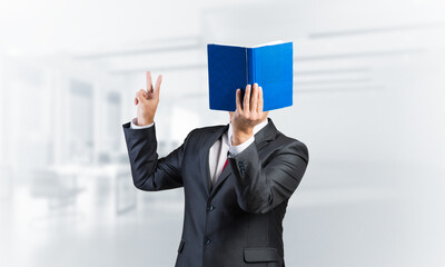 Businessman covered his face with book