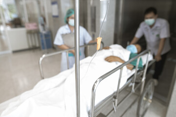 Blurred image of a patient lying in a hospital waiting for treatment.