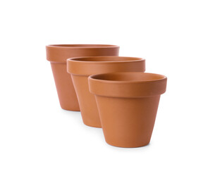 Stylish terracotta flower pots isolated on white