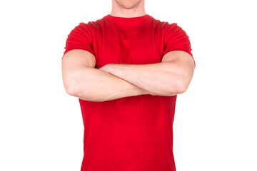Front view of confident male in blank red t-shirt posing with crossed arms