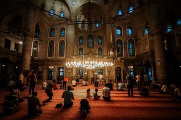 Eyup Sultan Mausoleum Mosque interior view. Many people praying. islam