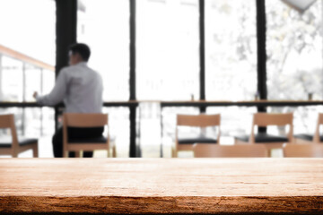 Empty wood table cafe with blured background.