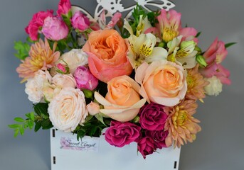 
wooden boxes with fresh flowers