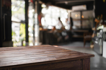 Empty desk platform over cafe background. For product display montage.