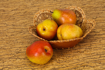 Pear heap in the wooden basket