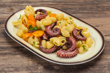 Pasta with octopus and yellow tomatoes