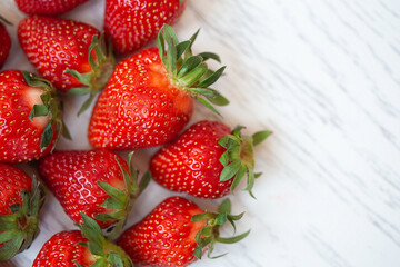 strawberries on a wooden white table