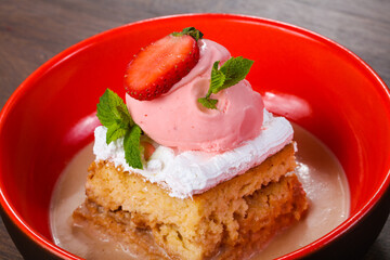 Cake with ice cream served stravberry
