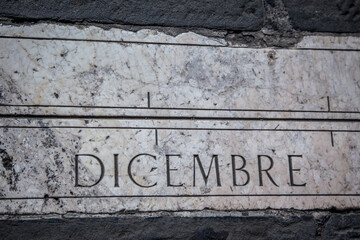 Zodiac symbol on a mottled granite pavement of the Old square in Bergamo. Lombardy, Italy