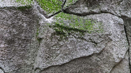 Stone rock texture or background. Gray rocky uneven surface, natural seamless backdrop for design. Copy space