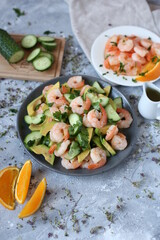 fresh shrimp, avocado and cucumber salad. shrimp fried in orange sauce